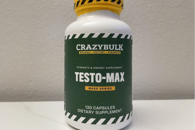 A bottle of CrazyBulk Testo-Max on a white counter against a white wall
