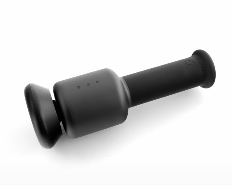 A sleek, black handheld portable massage device with a cylindrical handle and two flat, rounded ends lies on a white background. Three small indicator lights are visible on the side&mdash;an ideal choice for Father's Day gifts.