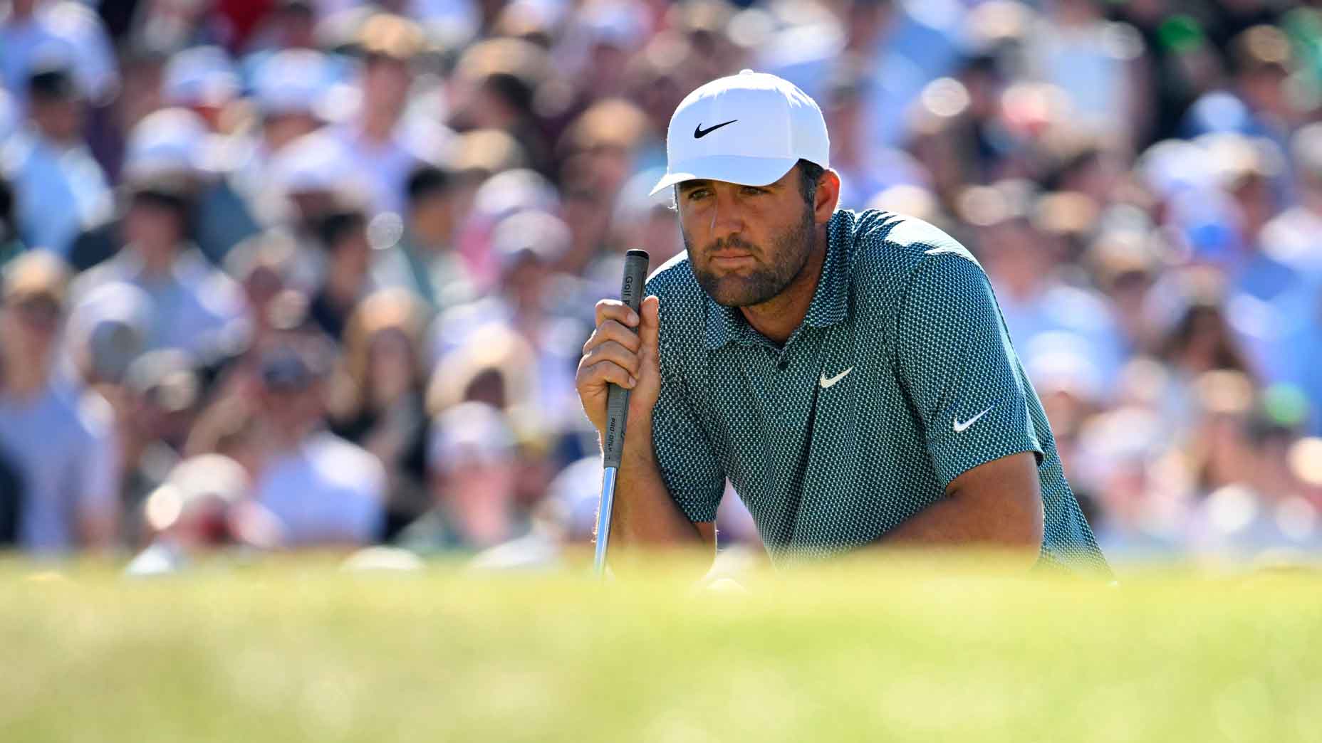 Scottie Scheffler of the United States lines up a putt on the 16th green during the final round of the WM Phoenix Open 2026 at TPC Scottsdale on February 08, 2026 in Scottsdale, Arizona. (Photo by Alex Goodlett/Getty Images)