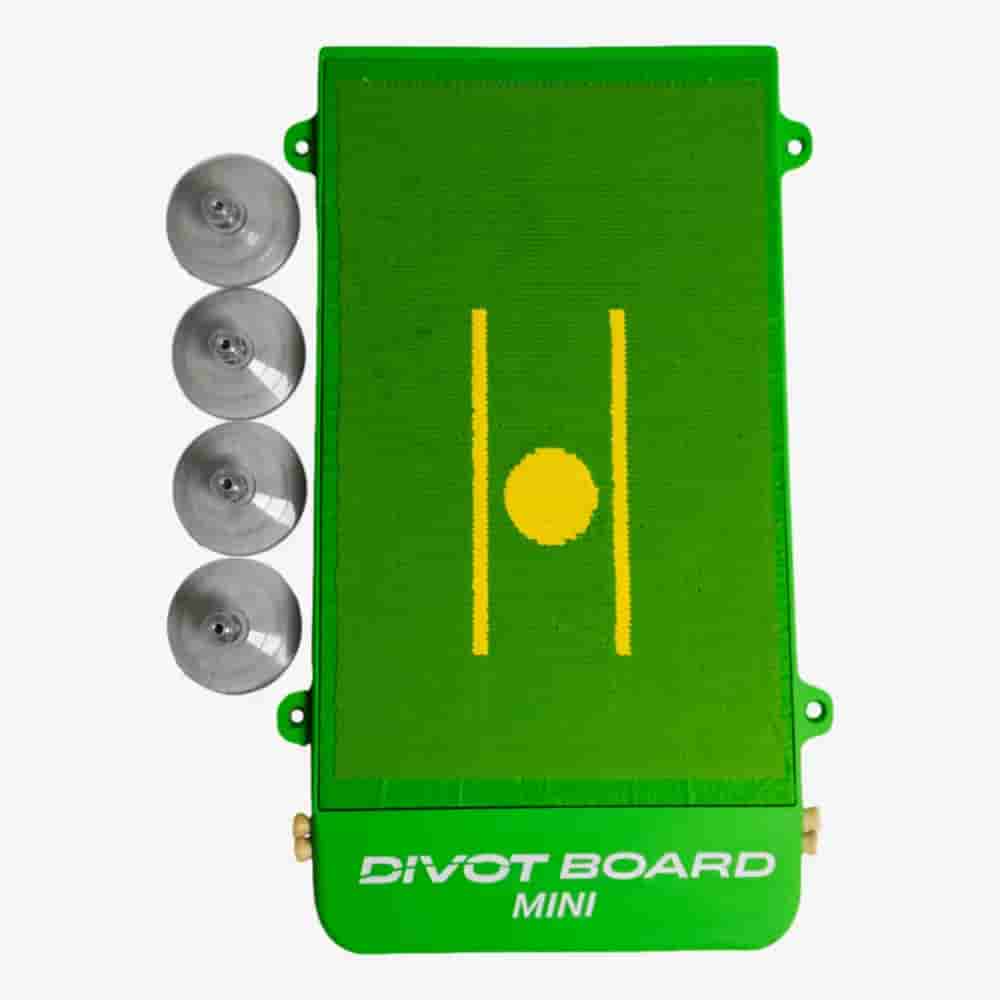 A green Divot Board Mini golf training aid with a yellow line and circle in the center, shown next to four suction cups on a white background&mdash;perfect for those seeking tools as innovative as the best golf bags 2026.