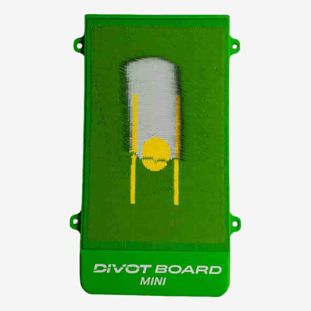 A green rectangular Divot Board Mini golf training aid with a yellow marker and white printed label at the bottom, perfect for golfers focused on swing path analysis and pairing well with the best golf bags 2026 has to offer.