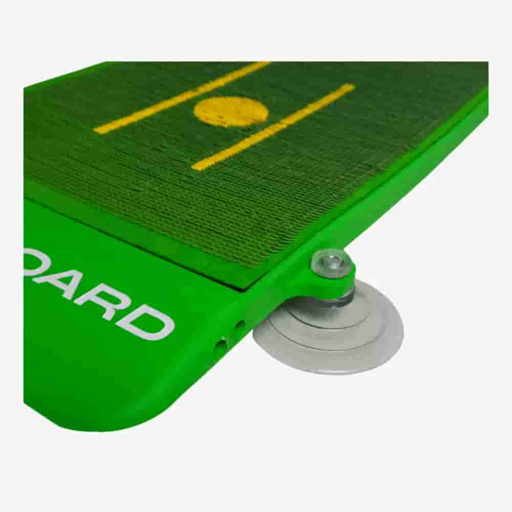 Close-up of a green cricket training board with a yellow pitch design, featuring a metal spring and round base for rebound practice&mdash;ideal for sports enthusiasts who also seek the best golf bags 2026 has to offer.