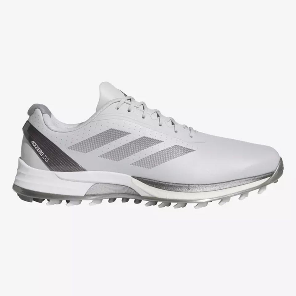 A white and gray athletic shoe with three gray stripes on the side, textured grip sole, and laces, inspired by the energy and style of Ryan Fox.