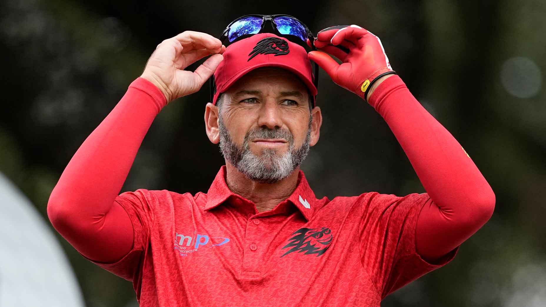 LIV Golf star Sergio Garcia lifts sunglasses at Dp World Tour event in 2025.