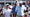 scottie scheffler and rory mcilroy walk at the players championship next to a tour confidential logo