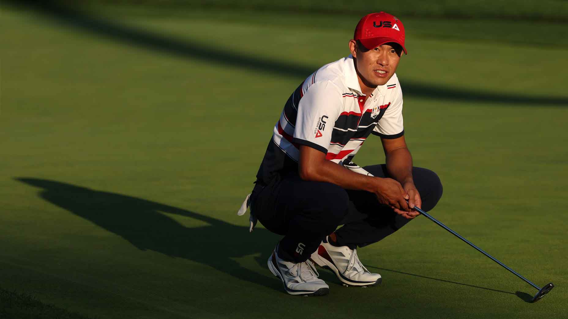 Collin Morikawa surveys a putt during the 2025 Ryder Cup