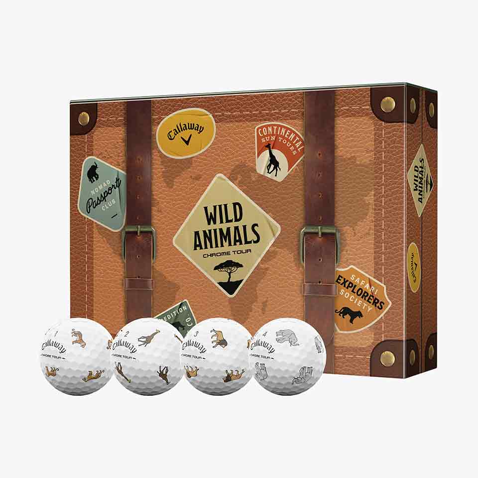 A suitcase-themed box labeled Wild Animals Chrome Tour with travel stickers evokes the spirit of adventure. In front, four white Callaway limited-edition golf balls each display small animal silhouettes&mdash;a perfect collector&rsquo;s find for enthusiasts and fans alike. Shop this unique set to elevate your next round.