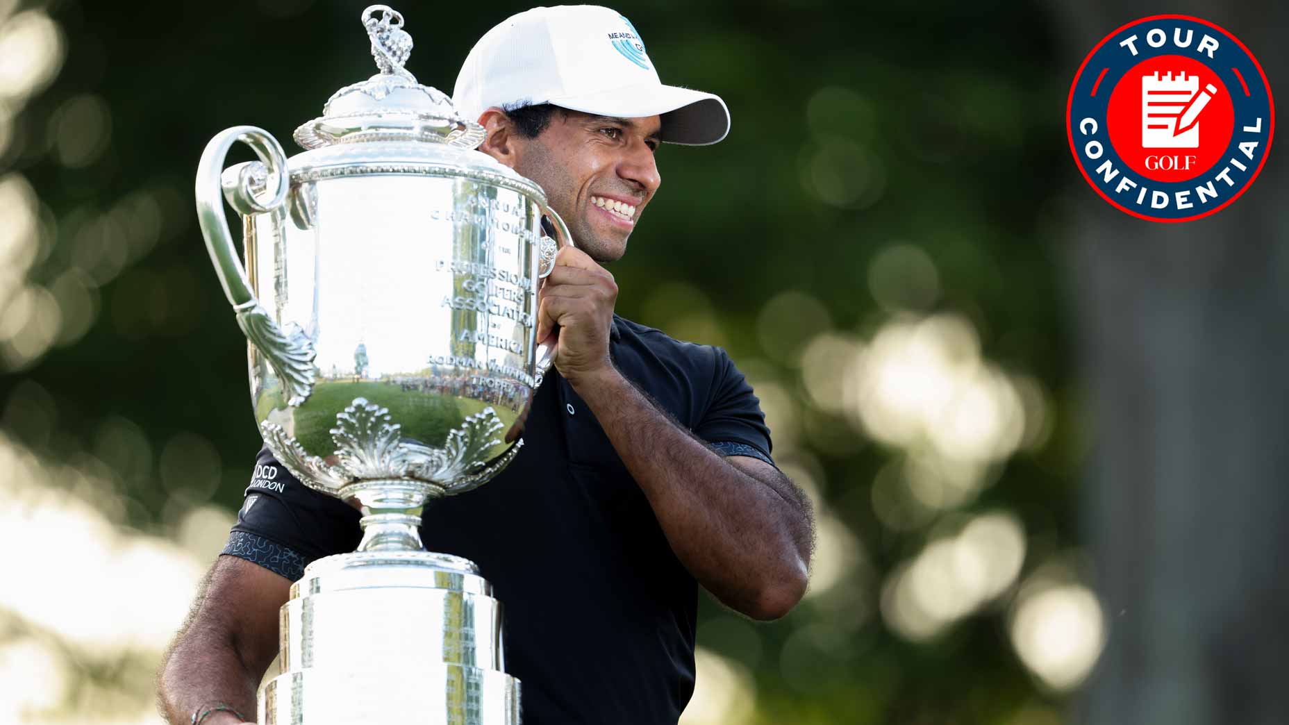aaron rai smiles holding the wanamaker trophy