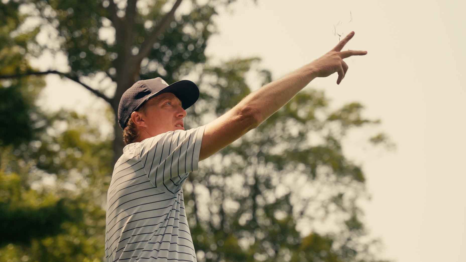 Brett Patterson tests the wind during the first round of the U.S. Amateur