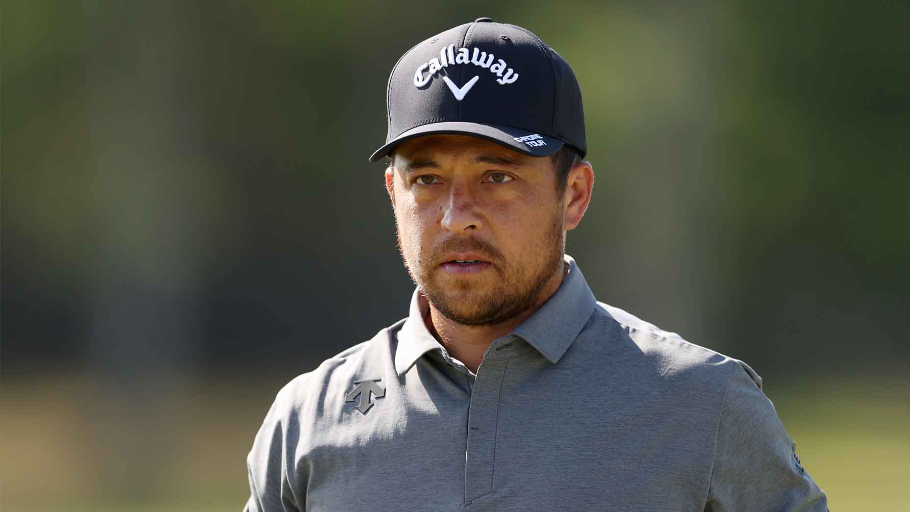 Xander Schauffele looks on during practice at the 2025 Genesis Scottish Open