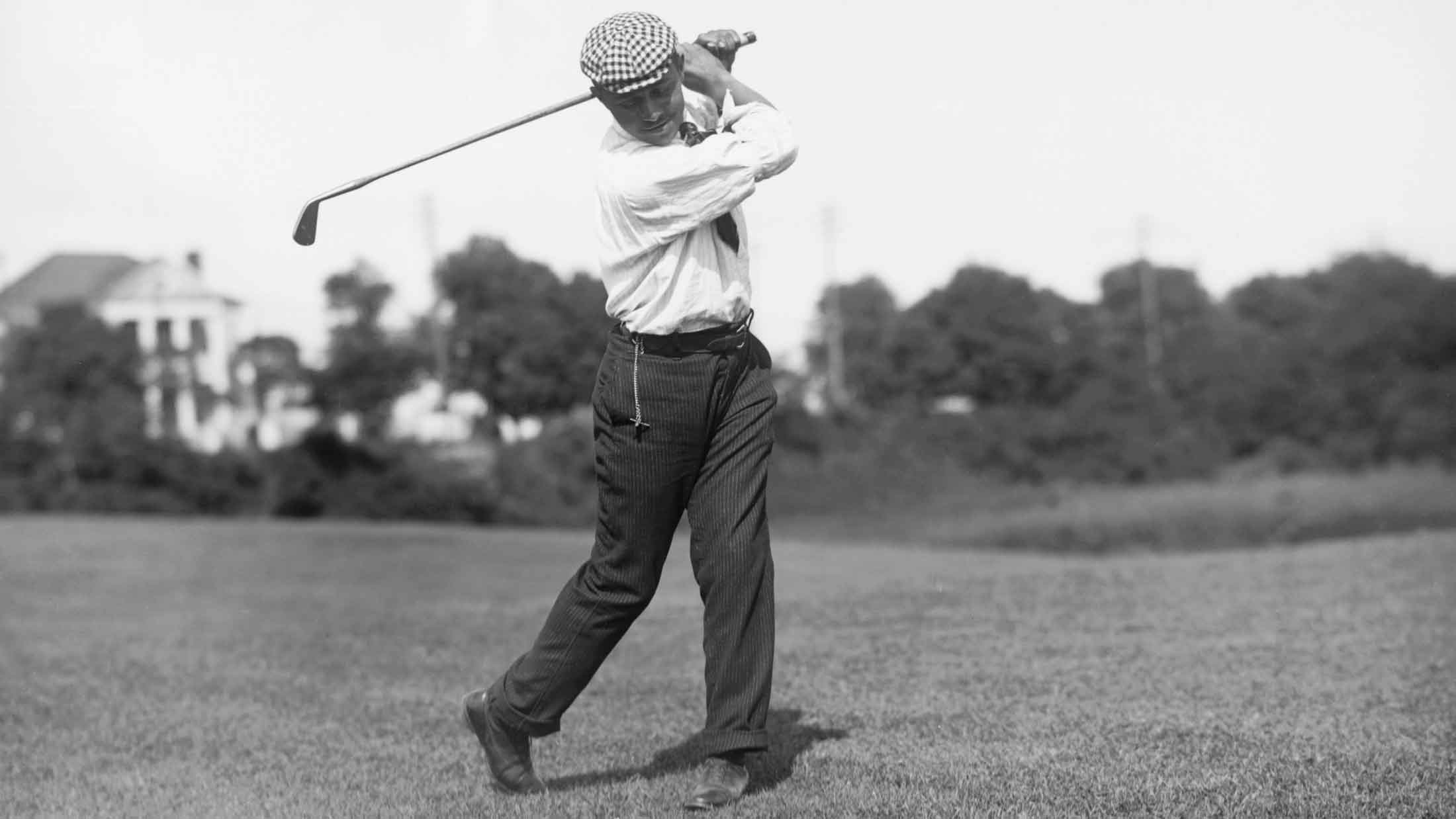 John Shippen Swinging Iron on Fairway
