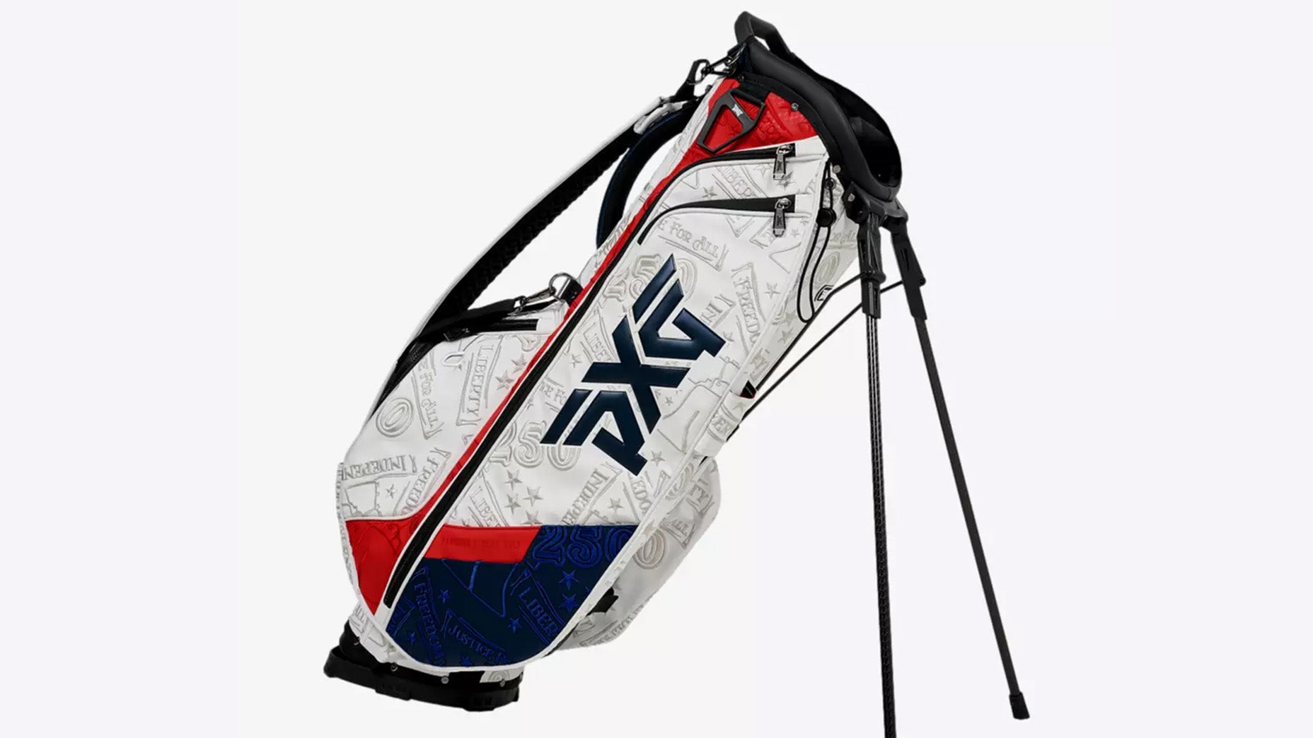 A white, red, and blue golf bag with the PXG logo in black stands on its extendable legs. Perfect for patriotic celebration or showing off your red white and blue gear, it features embossed patterns, graphics, and a convenient shoulder strap.