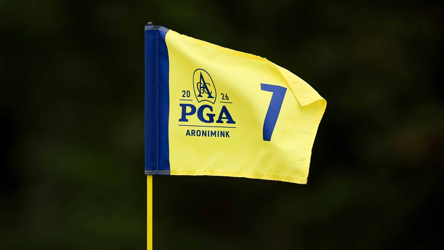 Yellow 2026 PGA Championship flag seen at Aronimink during tournament.