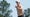 justin rose waves to the crowd during the final round of the 2025 masters