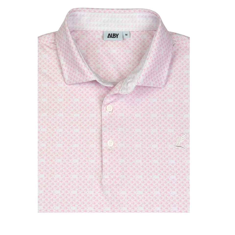 A folded light pink patterned polo shirt with a collar and three buttons. Featuring a subtle white geometric design and small embroidered logo, it's one of the best gift ideas for dads&mdash;perfect for Father's Day gifts or golf gifts. Tag shows brand ALBY, size M.
