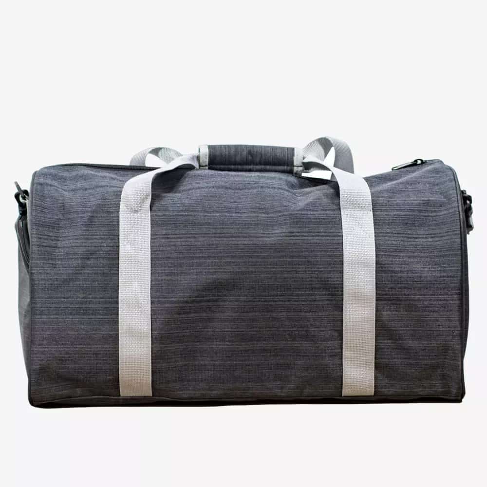 A gray duffel bag with white handles and a padded grip, photographed against a plain white background&mdash;perfect for carrying essentials like the best golf rangefinders to your next game.