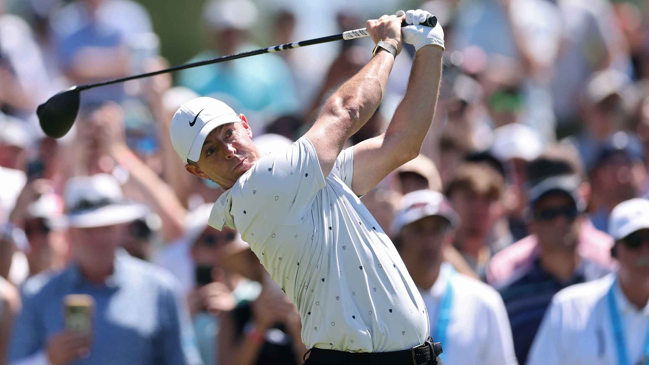 Rory McIlroy of Northern Ireland hits a tee shot on the 16th hole during the third round of the PGA Championship at Aronimink Golf Club o