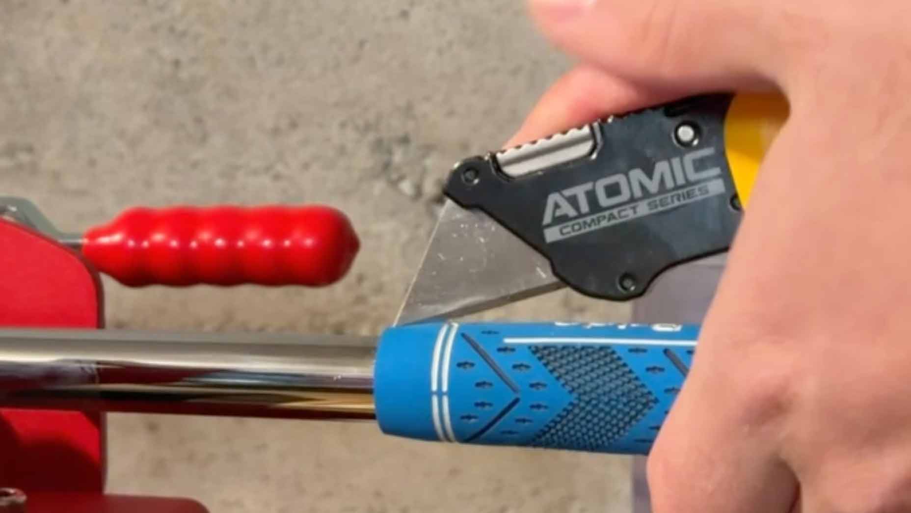 cutting golf grip.