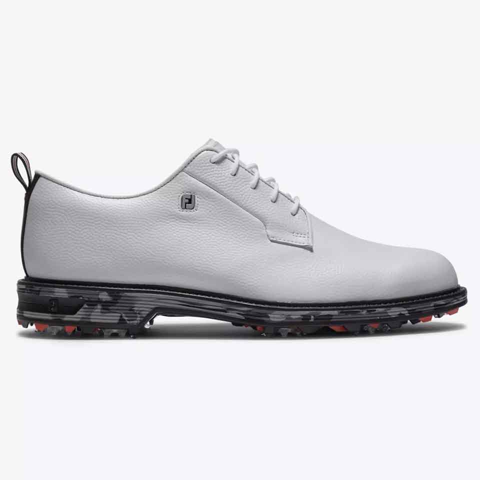 A stylish white leather golf shoe with black detailing, lace-up closure, and a rugged black sole featuring red accents for added traction.