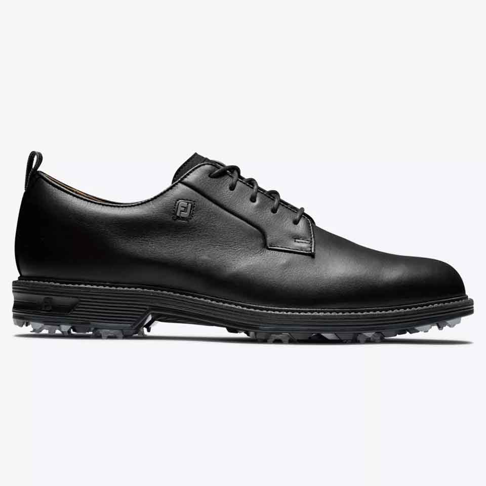 A black leather lace-up golf shoe with a low profile, textured sole for grip, and subtle branding on the side, this stylish shoe is displayed on a plain white background.