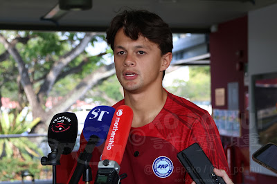 Perry Ng speaking to the media