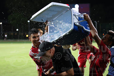 Outgoing Tigers' coach Peter de Roo given a shower after the match