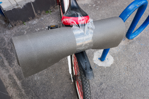 Cycling to Yoga Class with a yoga mat on your bike